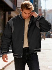 Detailed close-up of a men's American varsity jacket with metal snap buttons and ribbed cuffs