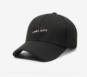 Side view of a black cotton baseball cap featuring NYC 3D embroidery and curved brim