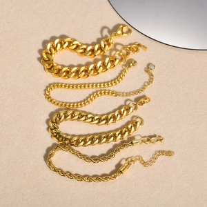 Detailed view of multiple gold stainless steel chain styles including Cuban and rope links