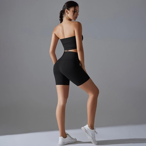 Detail view of seamless high-waist black sports shorts with tummy control and lift effect