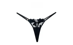 Detail of floral embroidery on mesh thong with thin elastic straps and metal rings