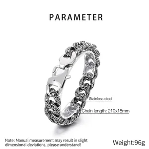 Macro shot of 18mm stainless steel Cuban link bracelet showing detailed engraved patterns