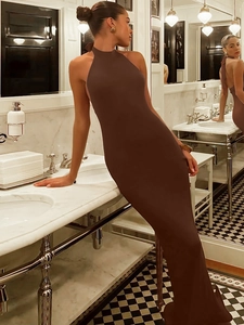 Brown halter neck backless bodycon maxi dress with vertical rib texture in luxury setting