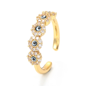 Adjustable golden evil eye ring with blue zircons and micro-pave setting on white background