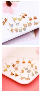 Detail view of colorful marine animal stud earrings with vibrant zircon inlays