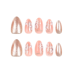 Almond-shaped press on nails featuring rose gold glitter and white floral art on nude base