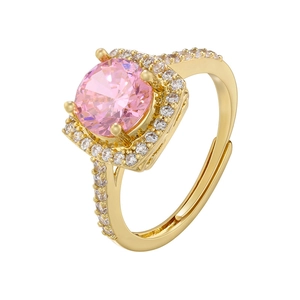 Detailed macro of gold adjustable ring with pink round zircon and prong setting