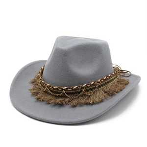 Detail of grey wide brim felt hat with tassels, gold chains and braided leather trim