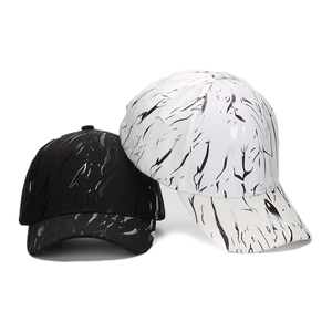 Set of black and white baseball caps with marble texture and metallic glossy finish
