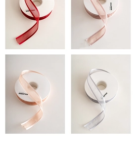 Detail of Christmas organza ribbons in burgundy, pink, champagne and silver gray colors