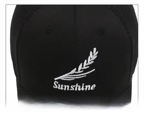 Close-up of black baseball cap featuring Sunshine embroidery and breathable mesh texture