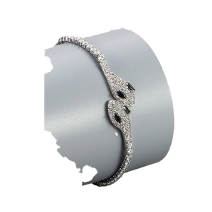 Elegant silver snake bracelet with pave diamonds and black eyes for women