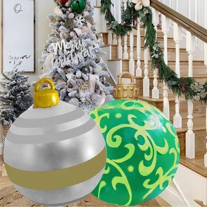 Detail of PVC inflatable Christmas balls with LED lights and festive patterns for yard decor