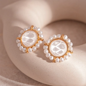 Elegant gold round stud earrings with white wave texture and pearl border