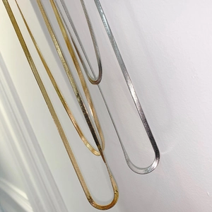 Titanium steel flat snake chain necklace in gold and silver colors for a minimalist look