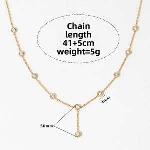 Macro view of gold chain necklace with 4mm cubic zirconia accents and Y-shape drop design