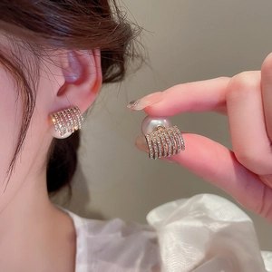 Elegant gold geometric stud earrings with pavé crystals and large pearl backings