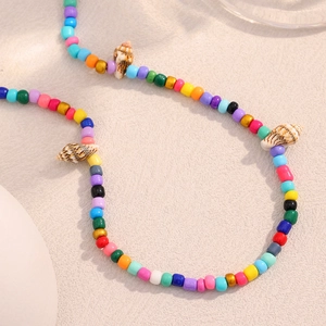 Colorful beaded necklace with shell accents and 18K gold plated stainless steel