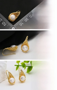 Detailed macro view of s925 silver needle pearl earring with 18k gold bird nest design