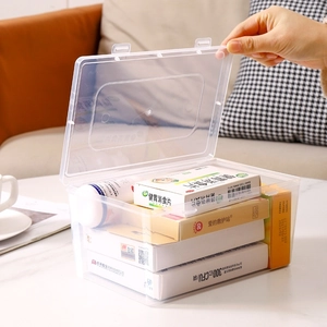 Transparent large capacity plastic medicine storage box with secure lid on marble surface