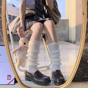 White knitted Lolita leg warmers in JK style with ribbed texture and warm slouchy fit