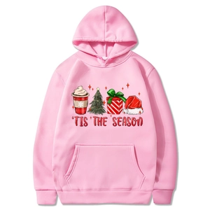 Pink Christmas hooded sweatshirt featuring 'TIS THE SEASON holiday prints with kangaroo pocket