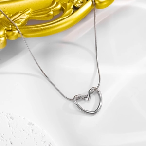 Minimalist silver hollow twisted heart necklace with fine snake chain for women