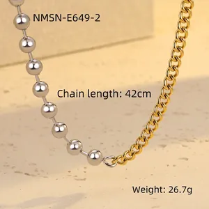 Detail of mixed-metal chain necklace with silver round beads and gold flat links