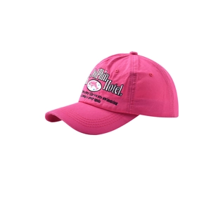 Detail of pink cotton baseball cap with black Dolphin Hotel embroidery and curved brim