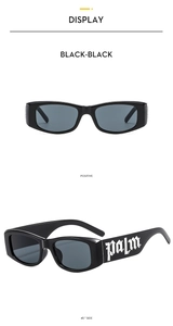 Detail view of black rectangular kids sunglasses with white gothic text on the side arm