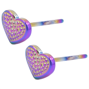 Macro shot of heart-shaped earrings with colorful gradient finish and textured dots