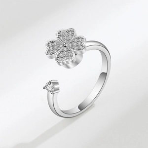 Rotating four-leaf clover ring with zircon inlay and open silver band design