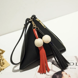 Chic black triangle wristlet bag in litchi leather with large wooden beads and tassels