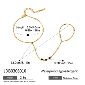 Detailed measurement view of 18k gold plated finger bracelet with black gemstones