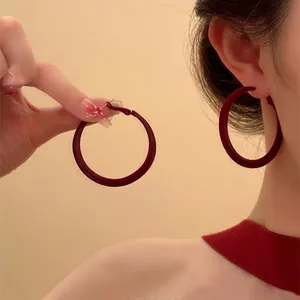 Vintage large dark red leather hoop earrings with matte texture and leopard pattern style
