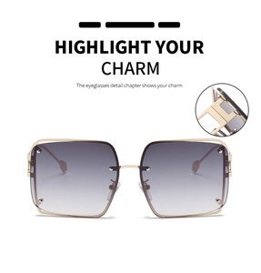 Detail showing gold metal square sunglasses frame with gradient grey-purple lenses