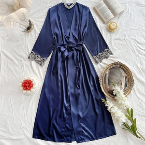 Navy blue satin long robe with V-neck and grey lace cuffs on white textured backdrop