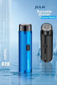 Blue and black portable mini electric shavers standing on clean water surface