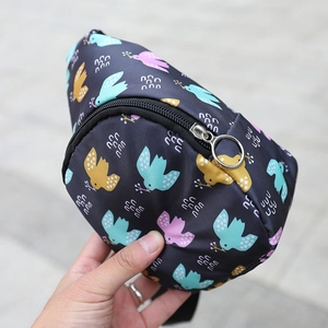 Detail of cartoon bird print on nylon waist bag for kids with silver metal ring zipper