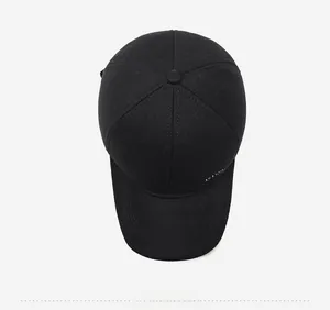 Top down view of black winter baseball cap showing thick wool blend texture and button