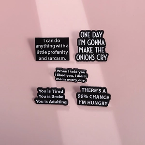 Set of five funny black enamel letter brooches with sarcastic quotes on pink background