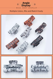 Detail view showing Halloween hair clips with spider web and pumpkin festive patterns