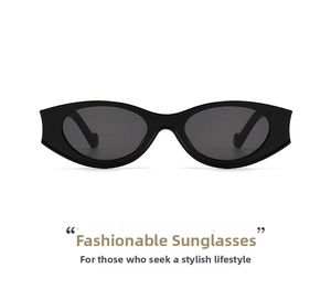 Close-up of narrow oval black sunglasses with glossy frames and dark grey lenses