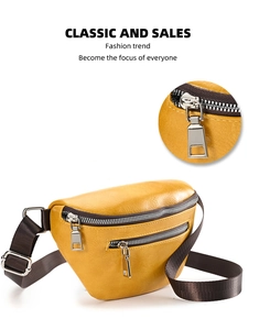 Detail of bright yellow leather waist bag with high-quality silver metal zipper