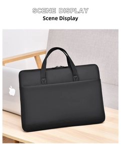 Detailed view of a black nylon laptop bag on a wooden desk with a sleek business design