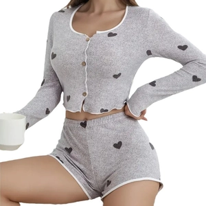 Women's heart print knit pajama set with long sleeve button top and ruffled shorts