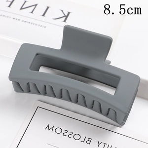 Matte rectangular hair claw clip for women, minimalist styling accessory for daily ponytails.