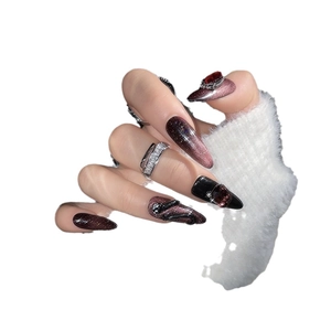 Dark red cat-eye press-on nails with 3D snake pattern and rhinestone accents