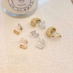 Minimalist geometric U-shaped ear clip converters in gold and silver with silicone pads