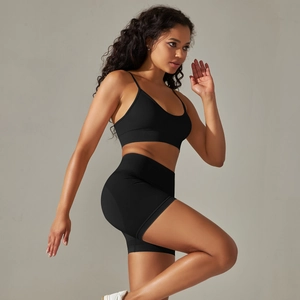 Detail of seamless ribbed knit sports bra and high waist shorts for fitness and yoga